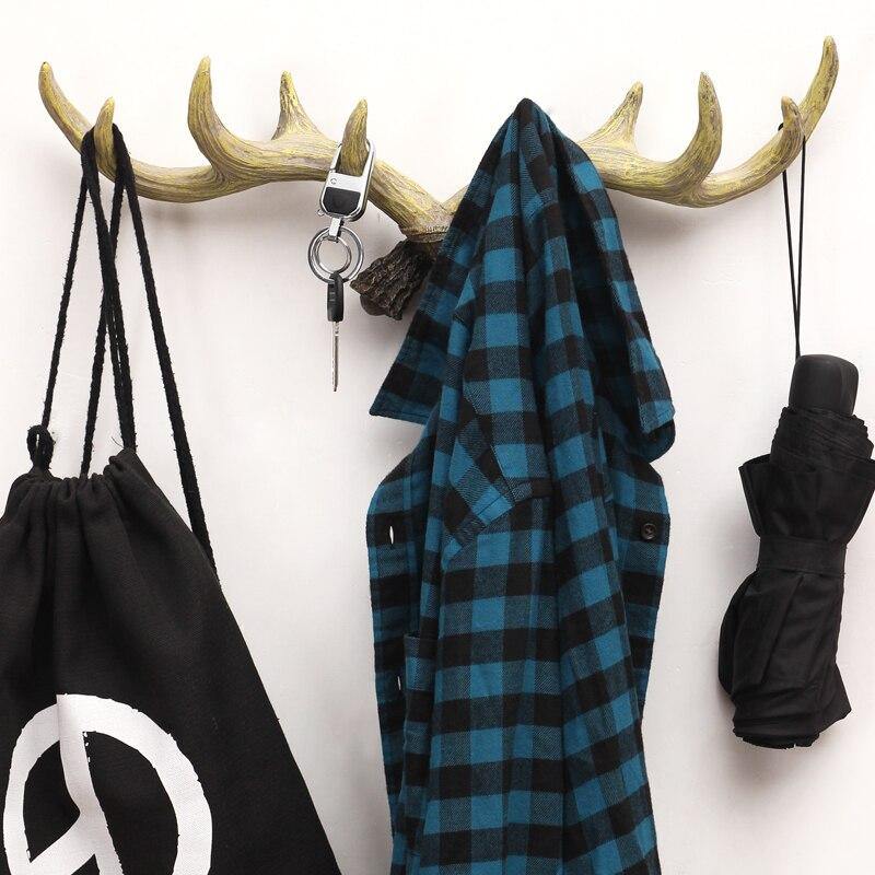 Space-saving coat holder